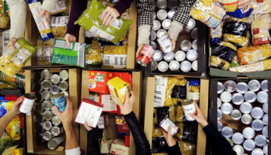 hands sorting food in warehouse